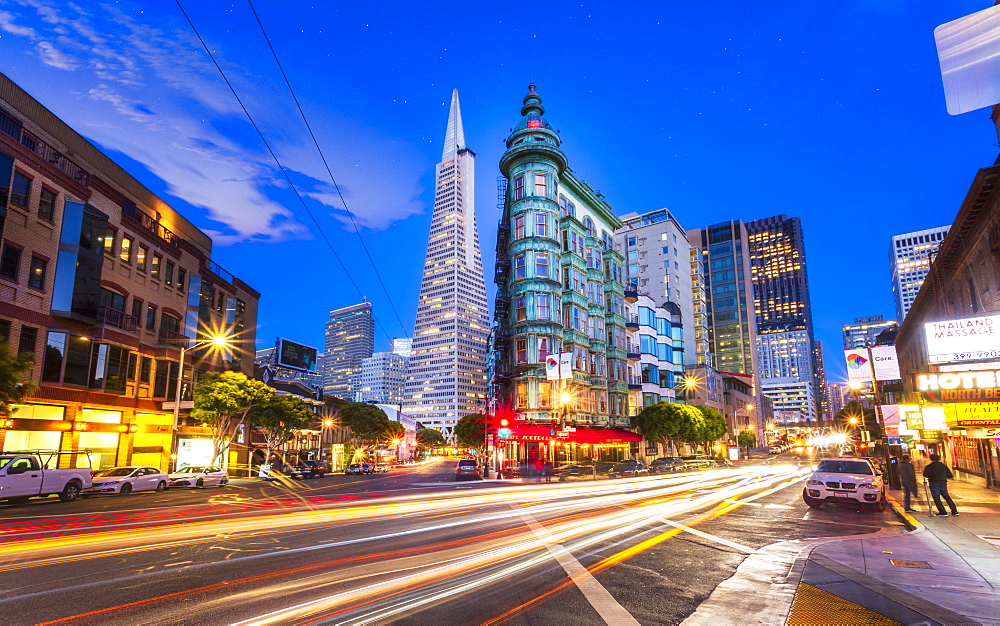 View of Transamerica Pyramid building on Columbus Avenue and car trail lights, San Francisco, California, United States of America, North America