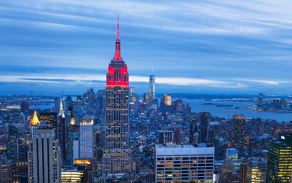 Lower Manhattan skyline from Top of The Rock, Empire State Building at night, New York, United States of America, North America