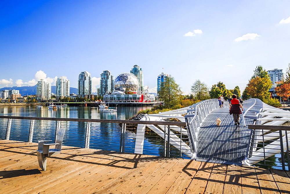 View of False Creek and city skyline, World of Science Dome, people walking, Vancouver, British Columbia, Canada, North America