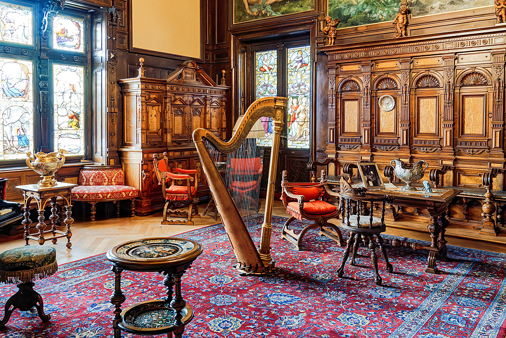 Interior decoration with a harp in the middle of the music room, Peles Castle, Sinaia, Romania, Europe