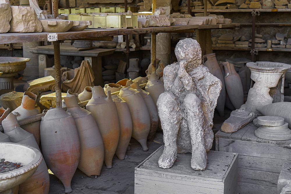 Human plaster cast of a body in the forum market, dead in the 79 AD Vesuvius volcanic eruption, Pompeii, UNESCO World Heritage Site, Campania, Italy, Europe