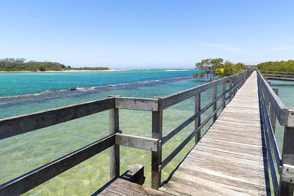 Ocean boardwalk in Urunga on the Coffs Coast stretching along the banks of the Kalang and Bellinger Rivers to the Pacific Ocean, Urunga, New South Wales, Australia, Pacific