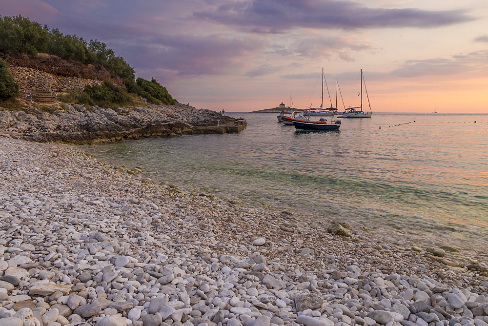 Boats anchoring at Pokonji Dol Beach near Hvar Town at sunset, Hvar, Croatia, Europe