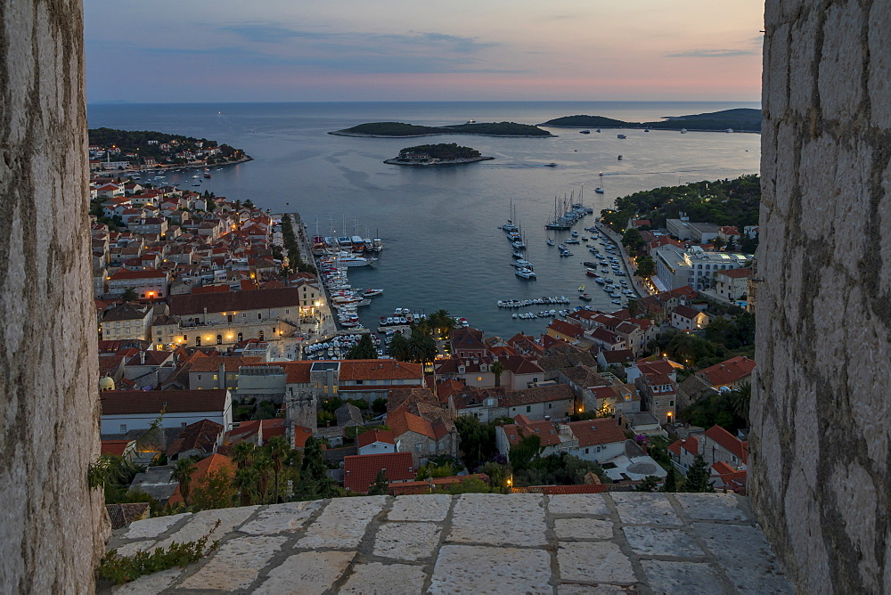 Elevated view over Hvar Town from the Spanish Fortress at dusk, Hvar, Croatia, Europe