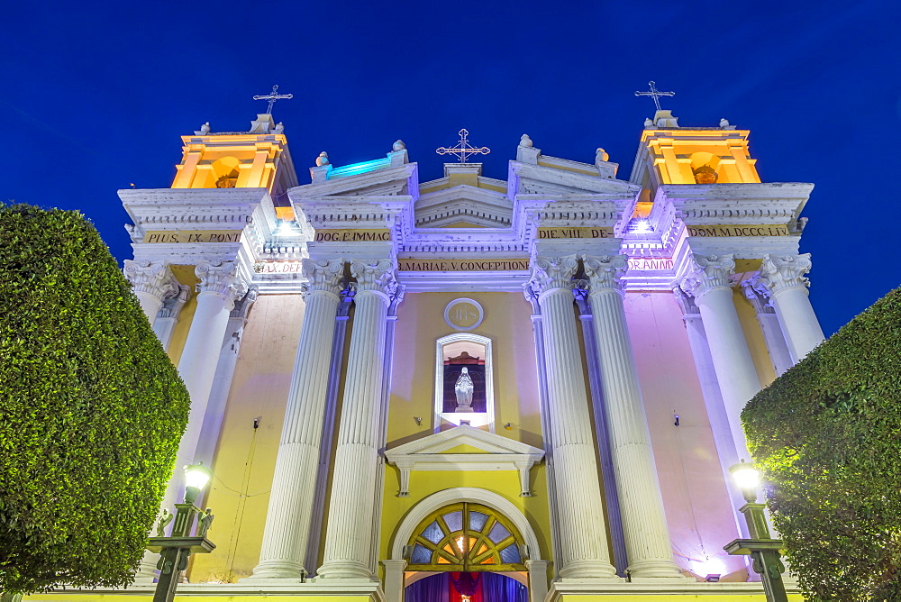 The illuminated Cathedral of Huehuetenango at dusk, Huehuetenango, Guatemala, Central America