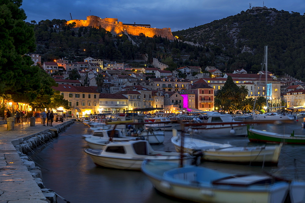 The port of Hvar Town and the Spanish Fortress at dusk, Hvar, Croatia, Europe