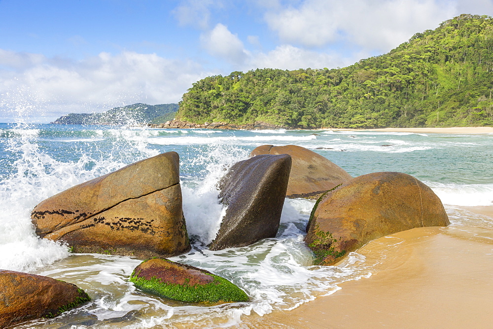 Waves splashing against rocks, Antigo Beach, Paraty (Parati), Rio de Janeiro, Brazil, South America