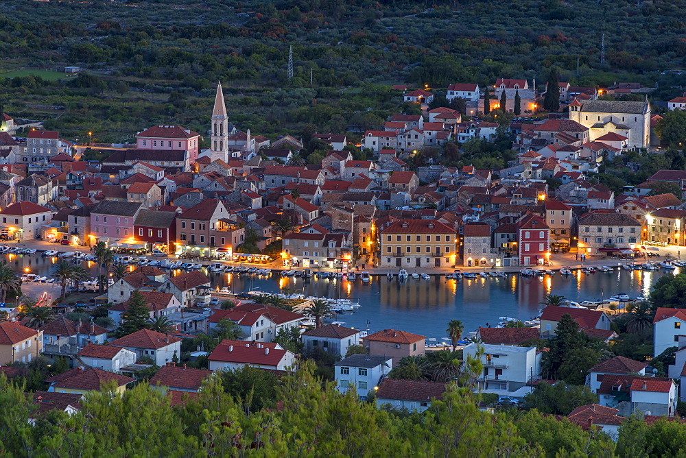 View from the lookout atop Glavica Hill over Stari Grad on Hvar Island at dusk, Hvar, Croatia, Europe