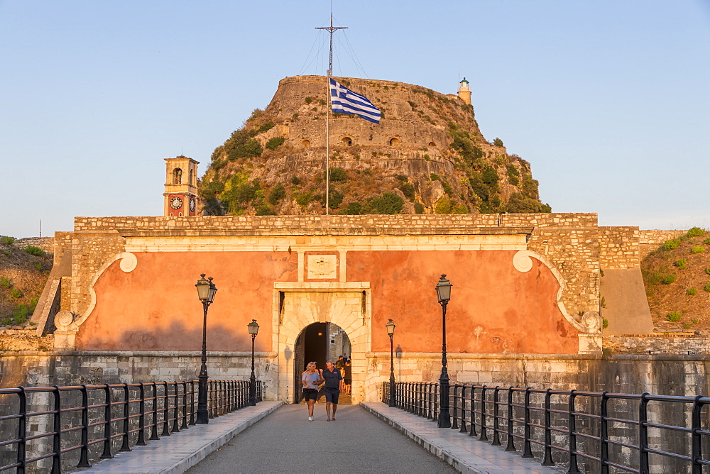 Entrance gate with the old fortress of Corfu Town (Kerkyra) in the background at sunset, Corfu, Greek Islands, Greece, Europe