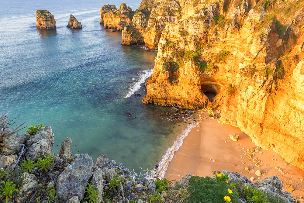 Secluded beach near Ponta da Piedade at first sunlight, Lagos, Algarve, Portugal, Europe