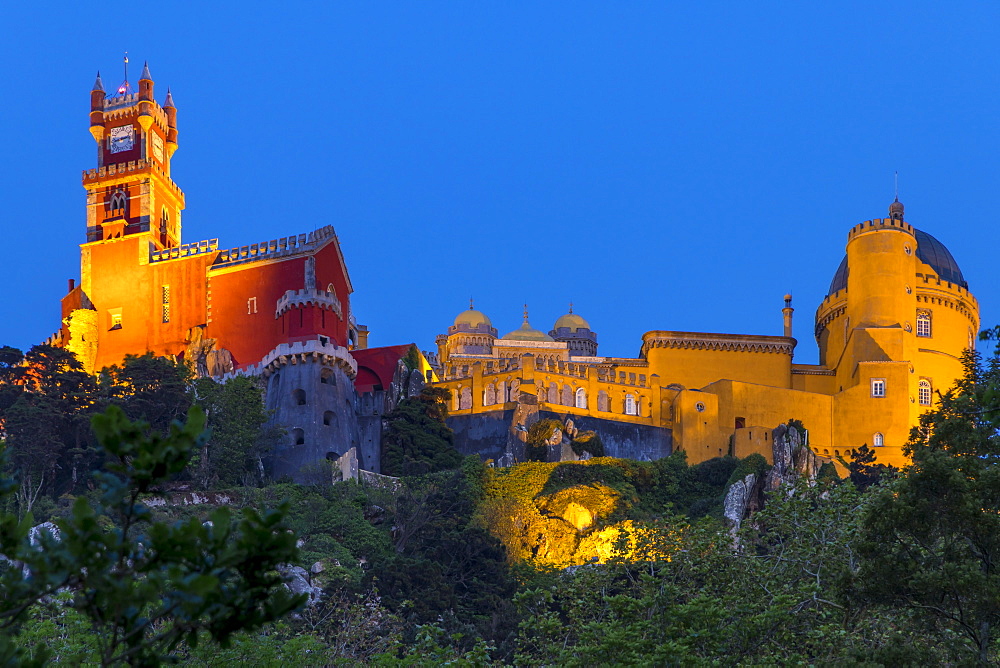 Illuminated Pena Palace at dusk, UNESCO World Heritage Site, Sintra, Portugal, Europe