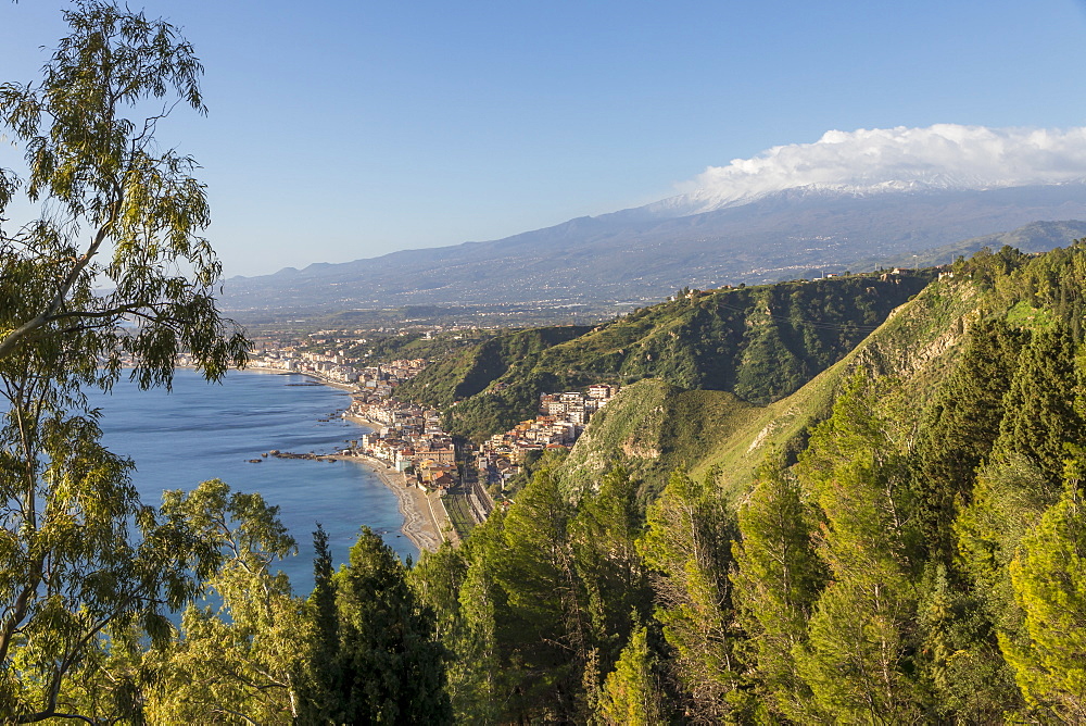 View from the public garden Parco Duca di Cesaro to Giardini Naxos and Mount Etna, Taormina, Sicily, Italy, Europe