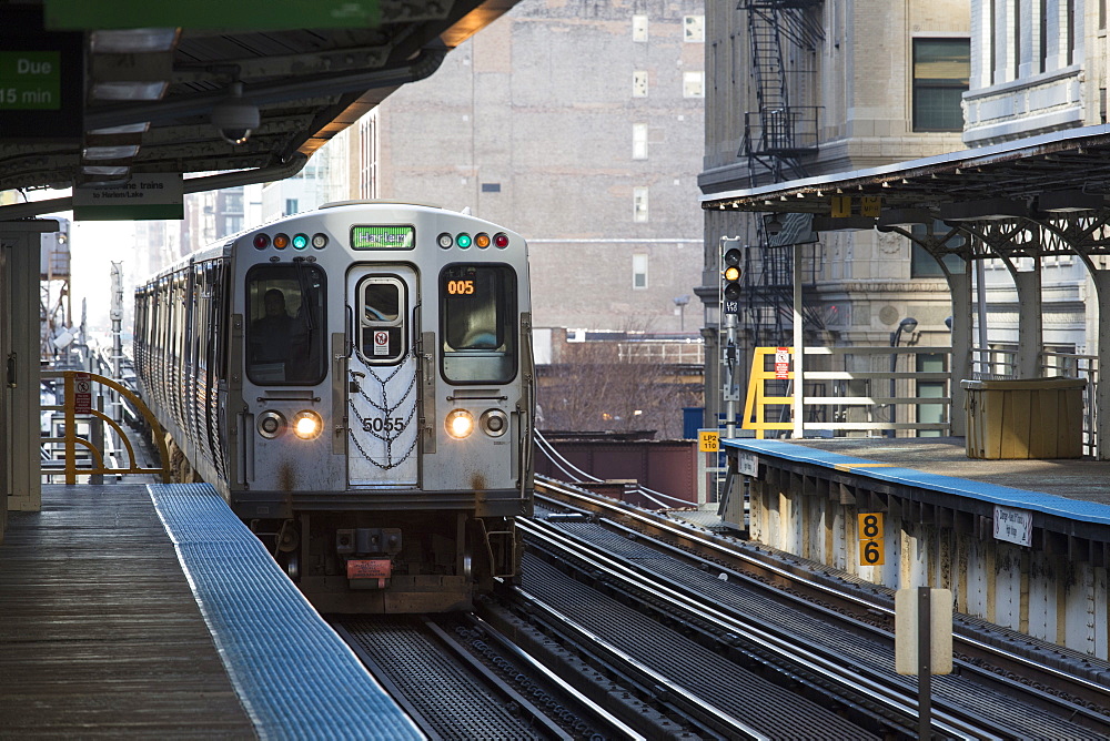 Green Line Chicago CTA L train to Harlem heading North at Adams and Wabash station, Chicago, Illinois, United States of America, North America