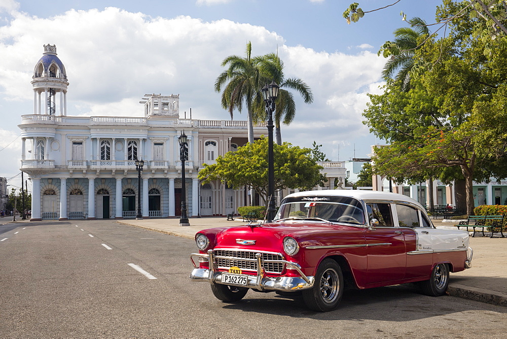 Red Chevrolet Bel Air parked in Cienfuegos town square, UNESCO World Heritage Site, Cuba, West Indies, Caribbean, Central America