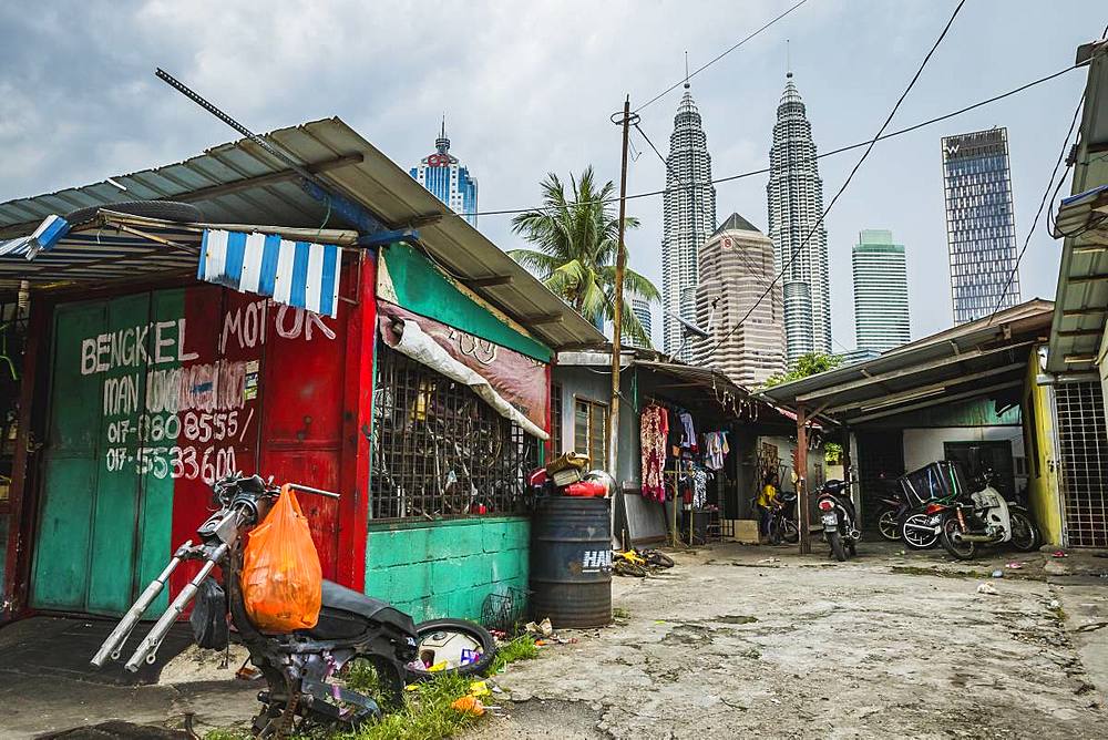 Side street in Kampung Baru with the Petronas Twin Towers in the background, Kuala Lumpur, Malaysia, Southeast Asia, Asia