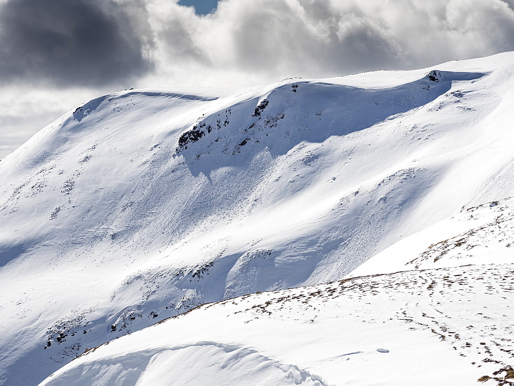 Fresh avalanche debris on Carn nan Sac, 920m, on the hills above Glenshee ski centre in the Cairngorm National Park, Scotland, United Kingdom, Europe