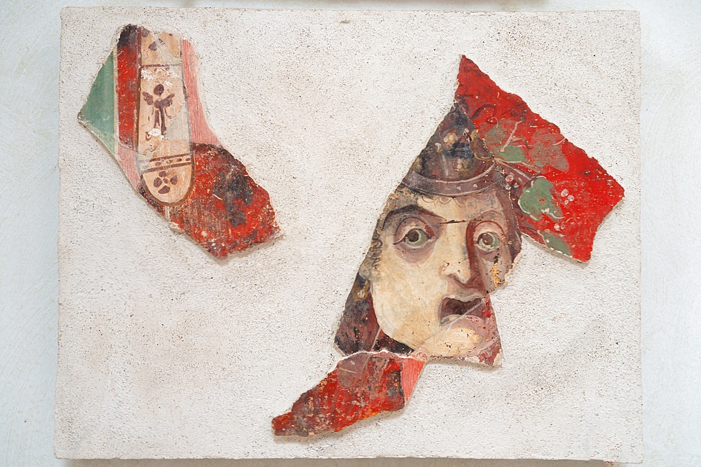 Fragments with garland, embroidered pattern and theatrical mask, Archaeological Area of ​​Solunto