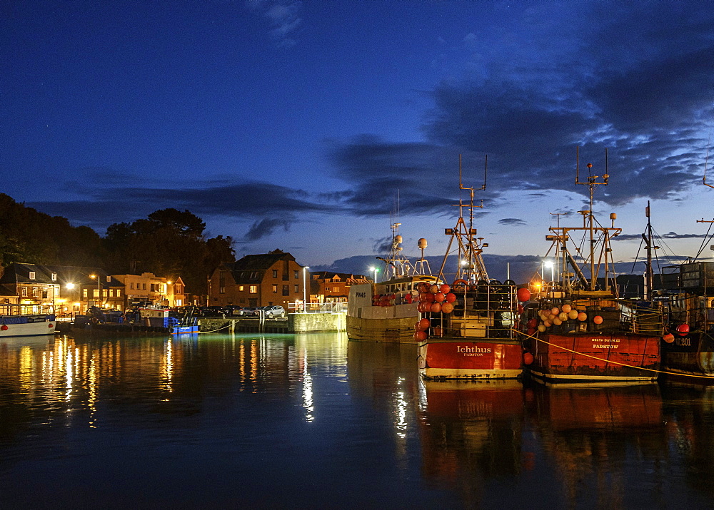 Boats and lights in the harbour of the popular fishing port of Padstow, Cornwall, England, United Kingdom, Europe