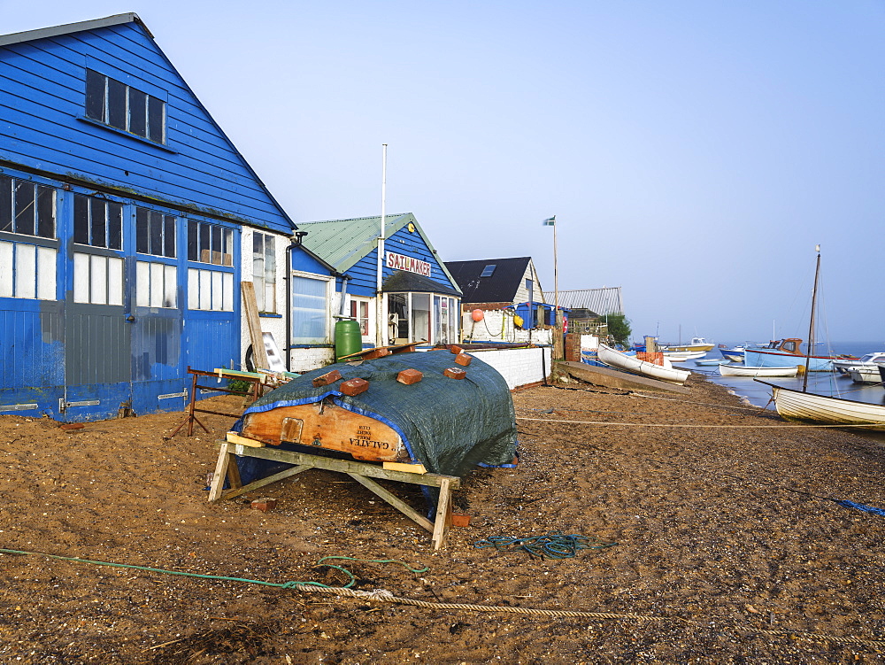 Sunshine with mist over the River Exe enhances this scene of boats and the sailmaker's loft, Exmouth, Devon, England, United Kingdom, Europe