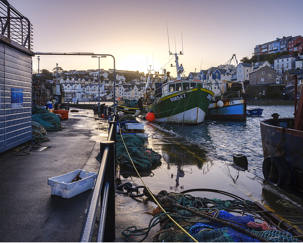 High tide at dawn in the harbour of the fishing port of Brixham, Devon, England, United Kingdom, Europe