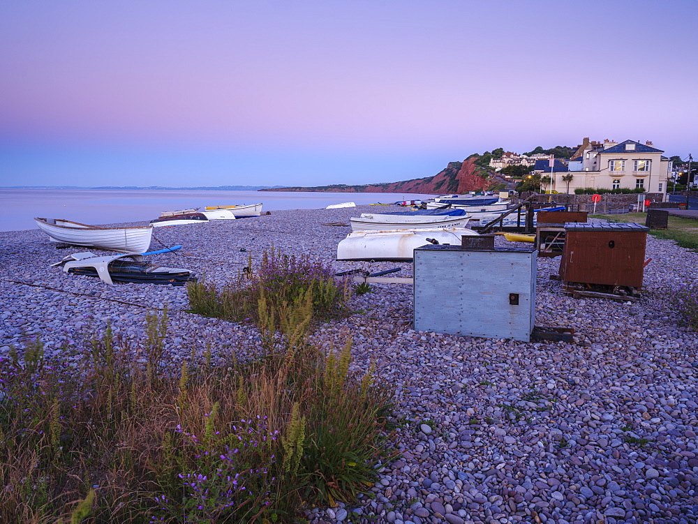 A lilac twilight with boats on the pebbled beach at Budleigh Salterton, Devon, England, United Kingdom, Europe