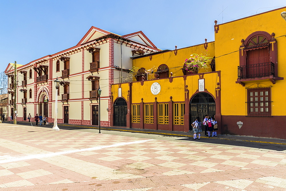 The colourful facade of the College of Ramon by Central Park, Leon, Nicaragua, Central America