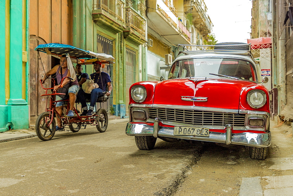 A vintage American car in a colourful street in Havana, Cuba, West Indies, Caribbean, Central America