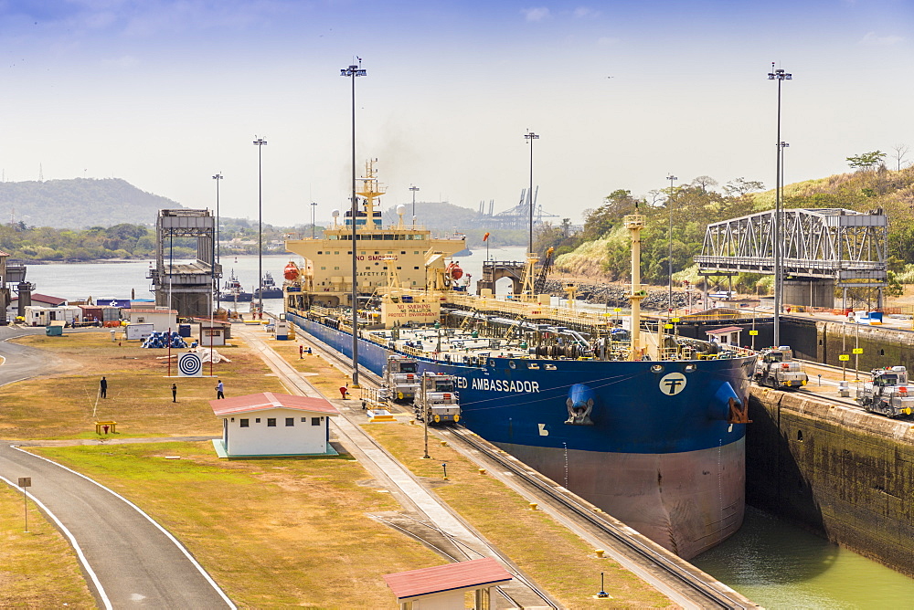 A ship passing through the Panama Canal at the Miraflores locks in Panama City, Panama, Central America