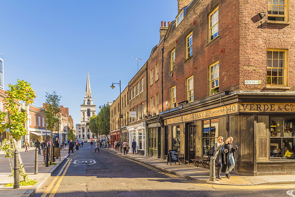 Beautiful old shops on Brushfield Street, with Christ Church in the background, in Spitalfields, London, England, United Kingdom, Europe