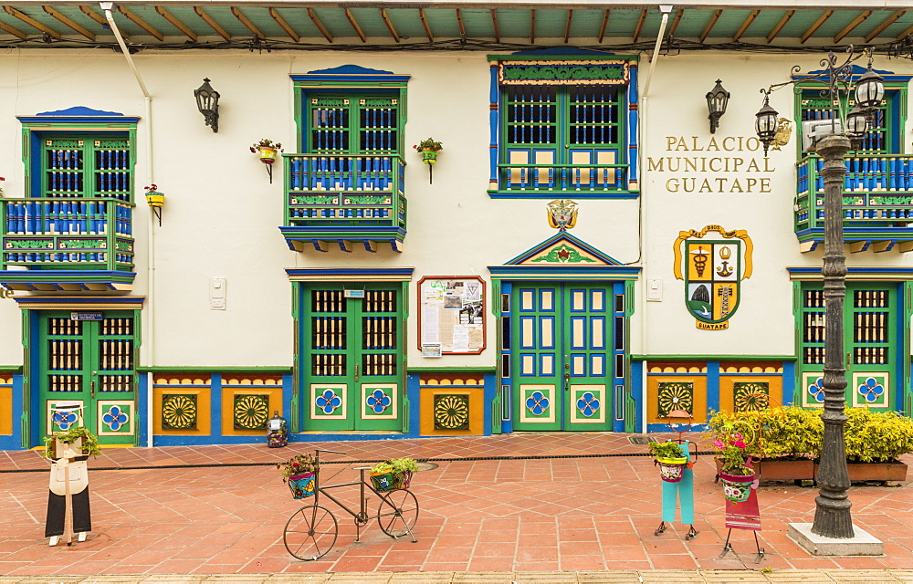 The colourful facade of the Palacio Municipal (City hall and tourist office), in the picturesque town of Guatape, Colombia, South America