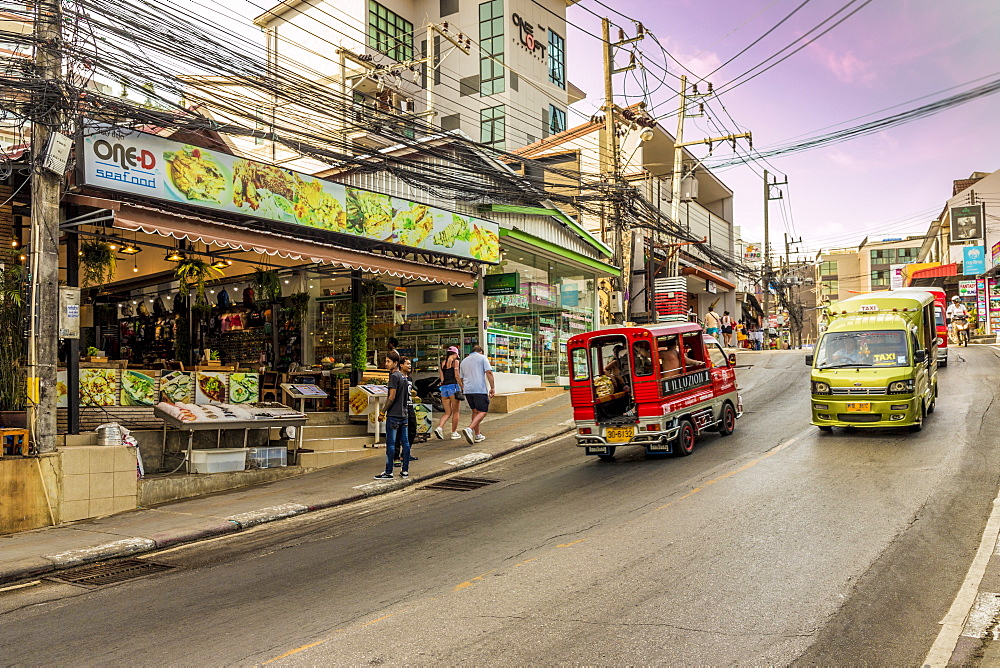 A street scene and local taxis and tuk tuks in Kata, Phuket, Thailand, Southeast Asia, Asia