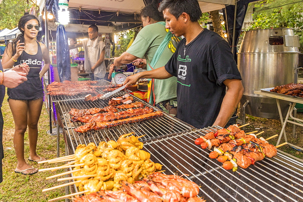 A food stall selling grilled meat in the night market in Kamala in Phuket, Thailand, Southeast Asia, Asia