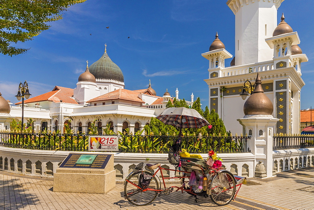 A local rickshaw (tuk tuk) outside Kapitan Keling Mosque, George Town, Penang Island, Malaysia, Southeast Asia, Asia