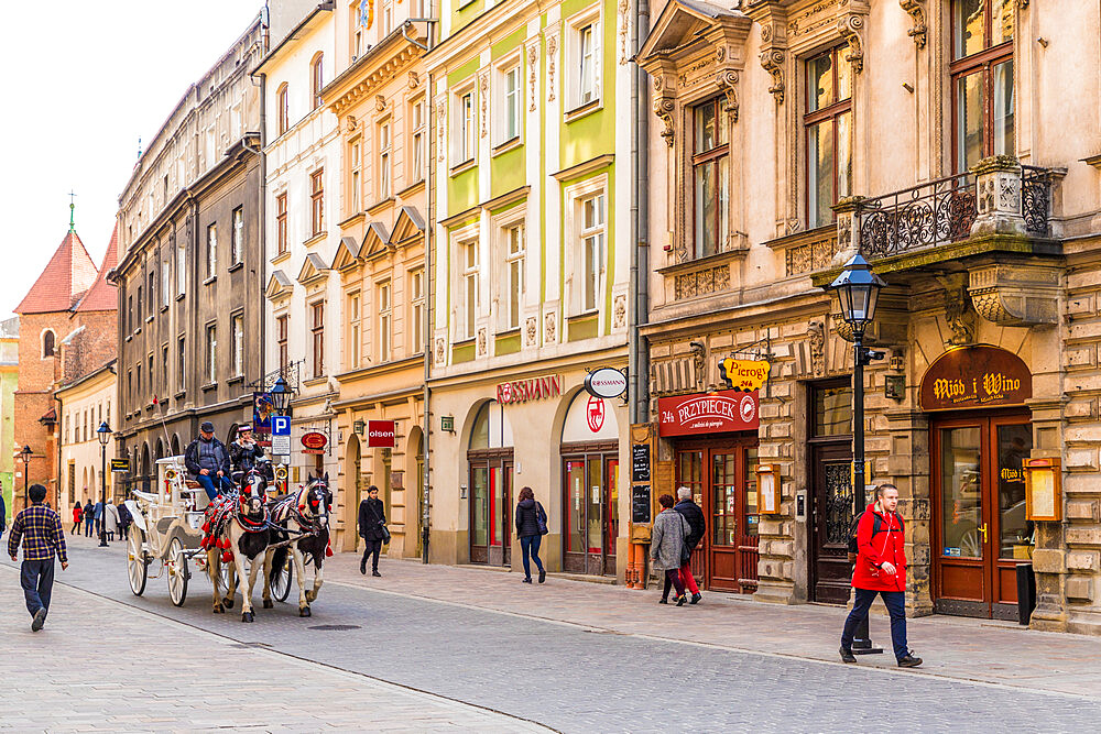 A horse drawn carriage in the medieval old town, UNESCO World Heritage Site, Krakow, Poland, Europe