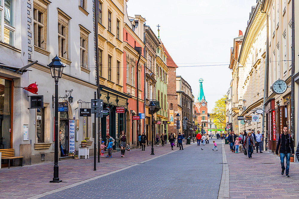 A street scene in the medieval old town, UNESCO World Heritage Site, Krakow, Poland, Europe