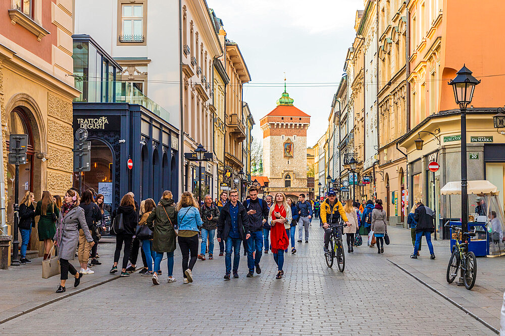 A street scene in the medieval old town, UNESCO World Heritage Site, Krakow, Poland, Europe