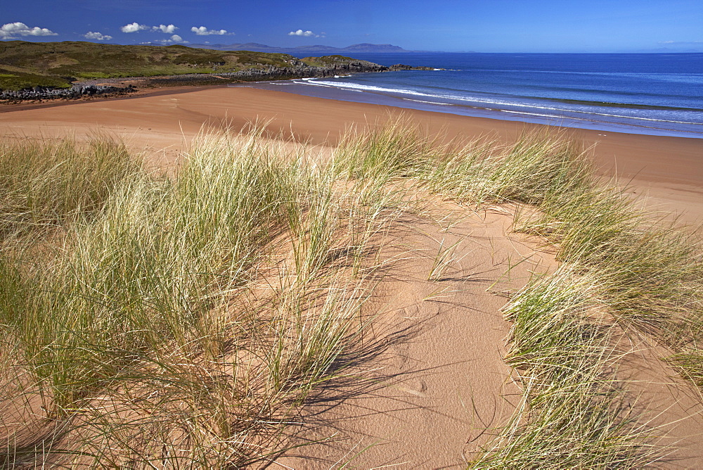 The remote sandy beach at Red Point with the Isle of Skye on the horizon, Wester Ross, Scotland, United Kingdom, Europe