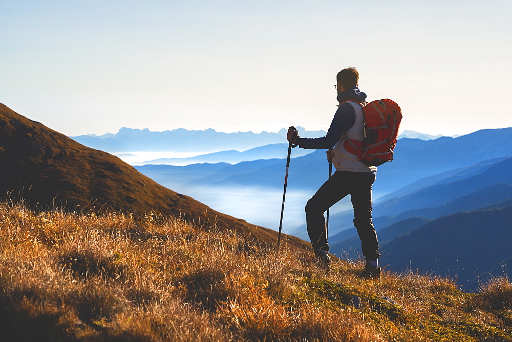 Mountain trekker in autumn season in Stelvio National Park in Brescia Province, Lombardy, Italy, Europe.