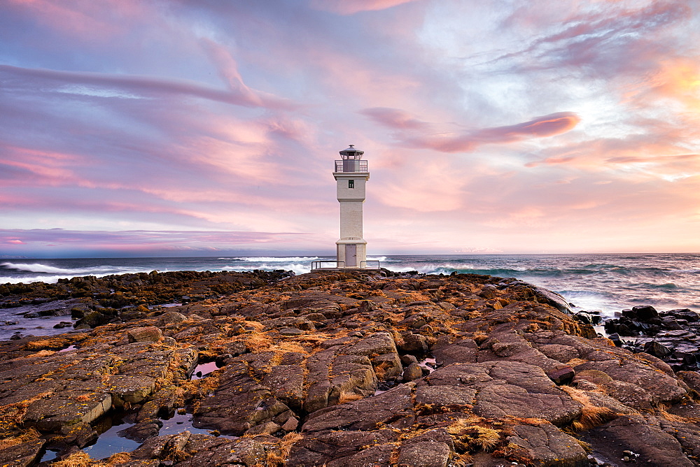 Old lighthouse in the volcanic landscape of Iceland near Akranes, the ninth most populous city in the country, Iceland, Polar Regions