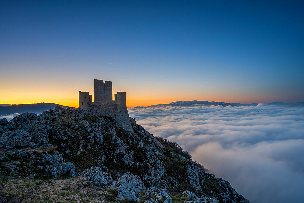 Rocca Calascio at sunrise with cloud inversion, Calascio, L'Aquila, Abruzzo, Italy, Europe