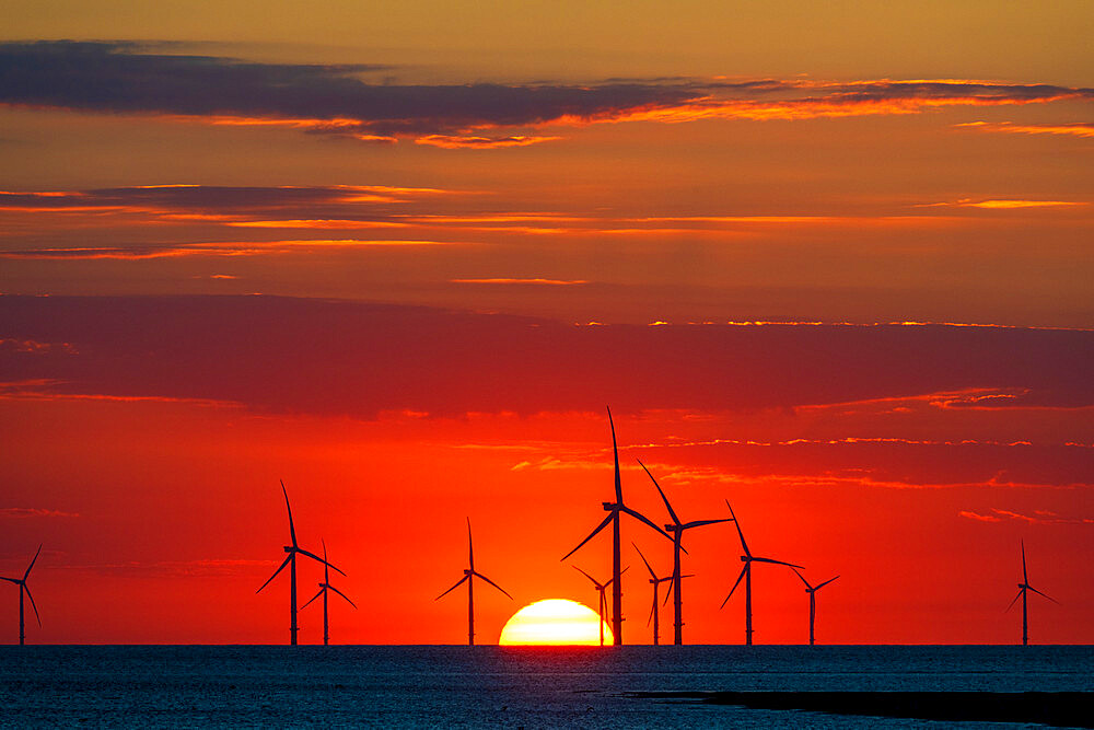 Offshore windfarm with amazing setting sun, New Brighton, Cheshire, England, United Kingdom, Europe