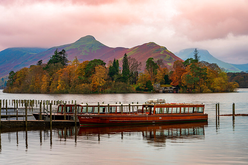 Passenger boat moored at Derwentwater in autumn, Lake District National Park, Keswick, Cumbria, England,