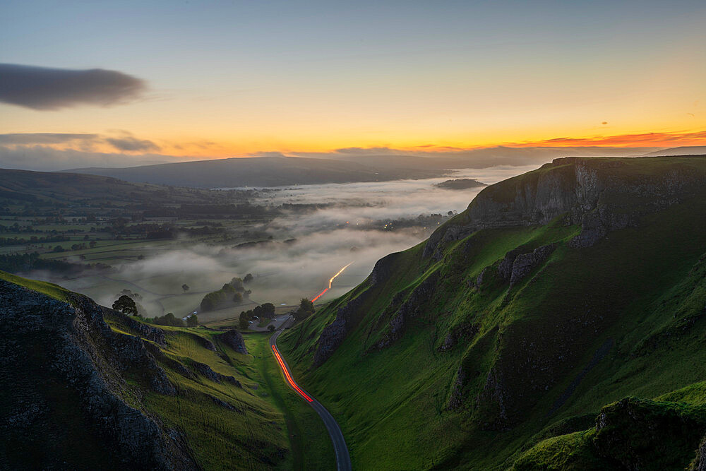 Winnats Pass at sunrise with car light trails, The Peak District, Derbyshire