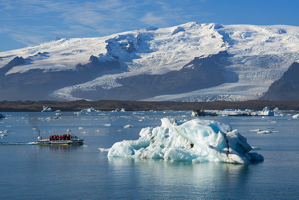 A boat tour on Jokulsarlon Glacier Lagoon, with Breidamerkurjokull Glacier behind, South East Iceland, Iceland, Polar Regions