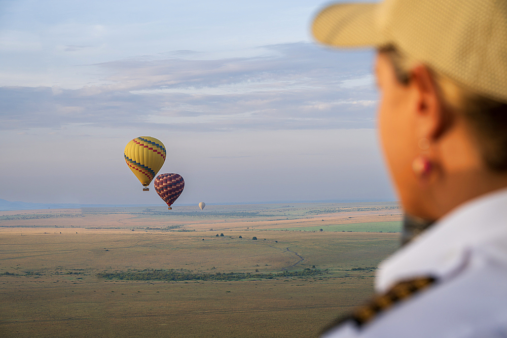 Female captain flying hot air balloon in Maasai Mara national reserve, Kenya