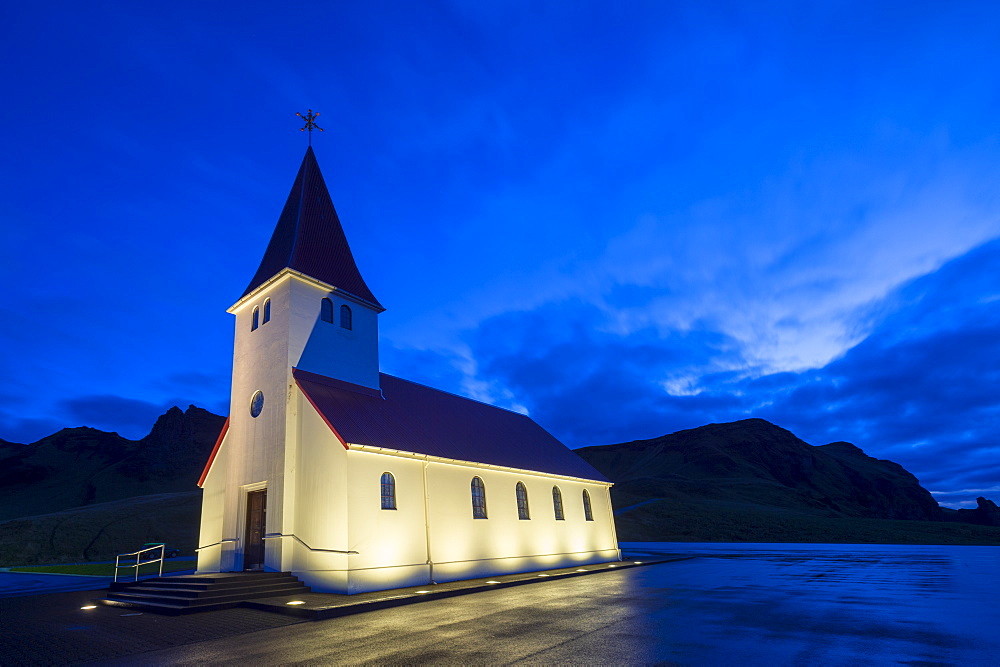 Floodlit church at dawn, near Vik, South Iceland, Iceland, Polar Regions