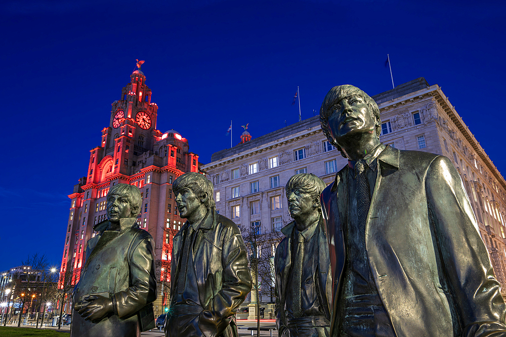 The Beatles statue at night, Liverpool waterfront, Liverpool, Merseyside, England, United Kingdom,