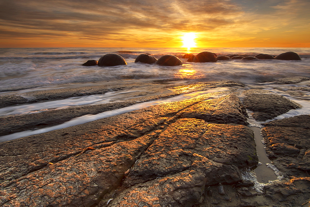 The Moeraki Boulders at sunrise, Moeraki Beach, Otago, South Island, New Zealand, Pacific