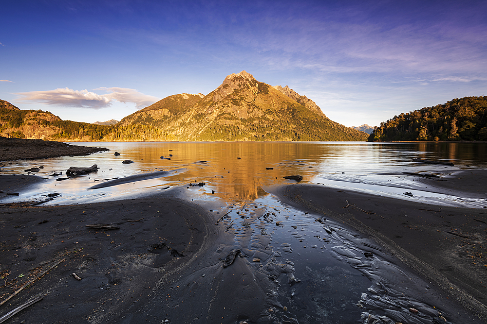 The black lava beach with reflected mountain, Bariloche, Patagonia, Argentina, South America