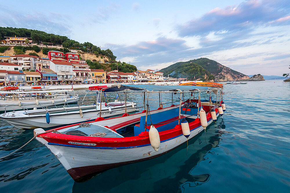 Tourist boats and the town of Parga in the background, Parga, Preveza, Greece, Europe